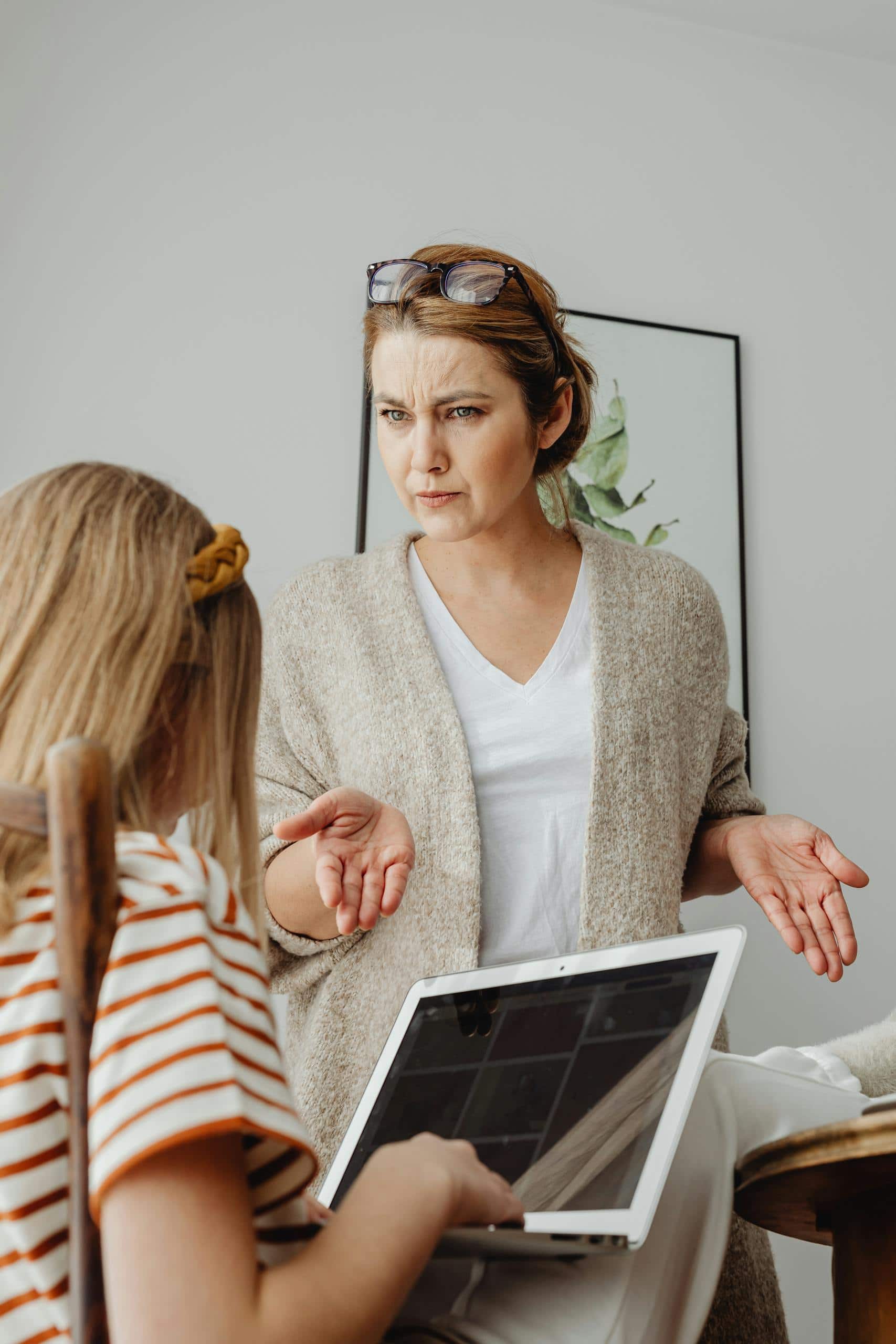A woman is talking to a young girl about choices regarding technology